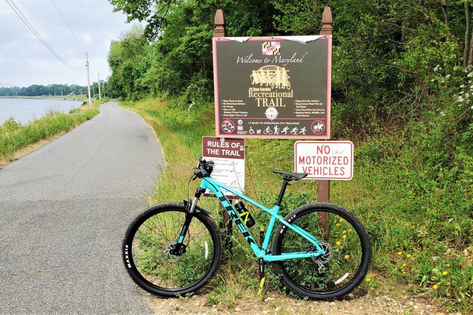 Maryland Delaware State Line with bike in front of marker