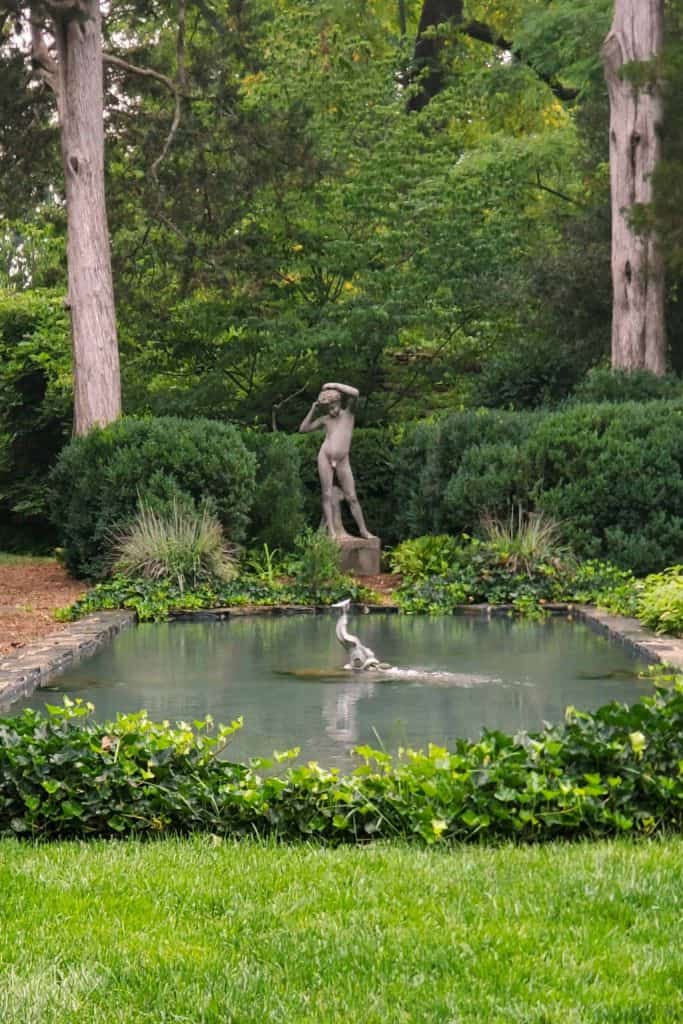 Statue and reflecting pool in the gardens at Oatland Historic House and Gardens