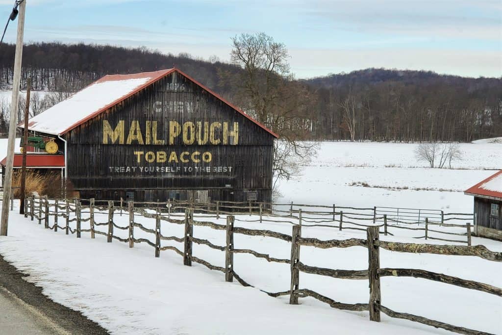 Ghost sign along a snowy road in the Laurel Highlands