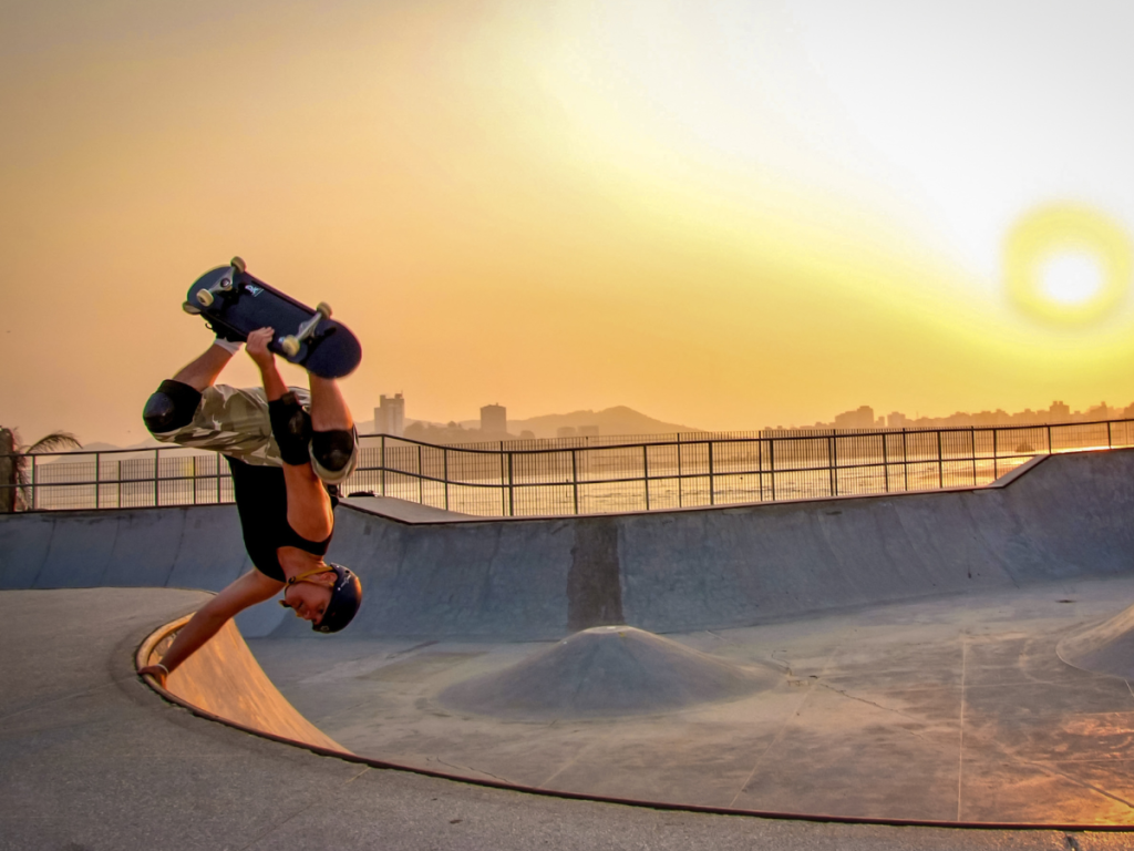 Skateboarder wearing a skate helmet while performing tricks