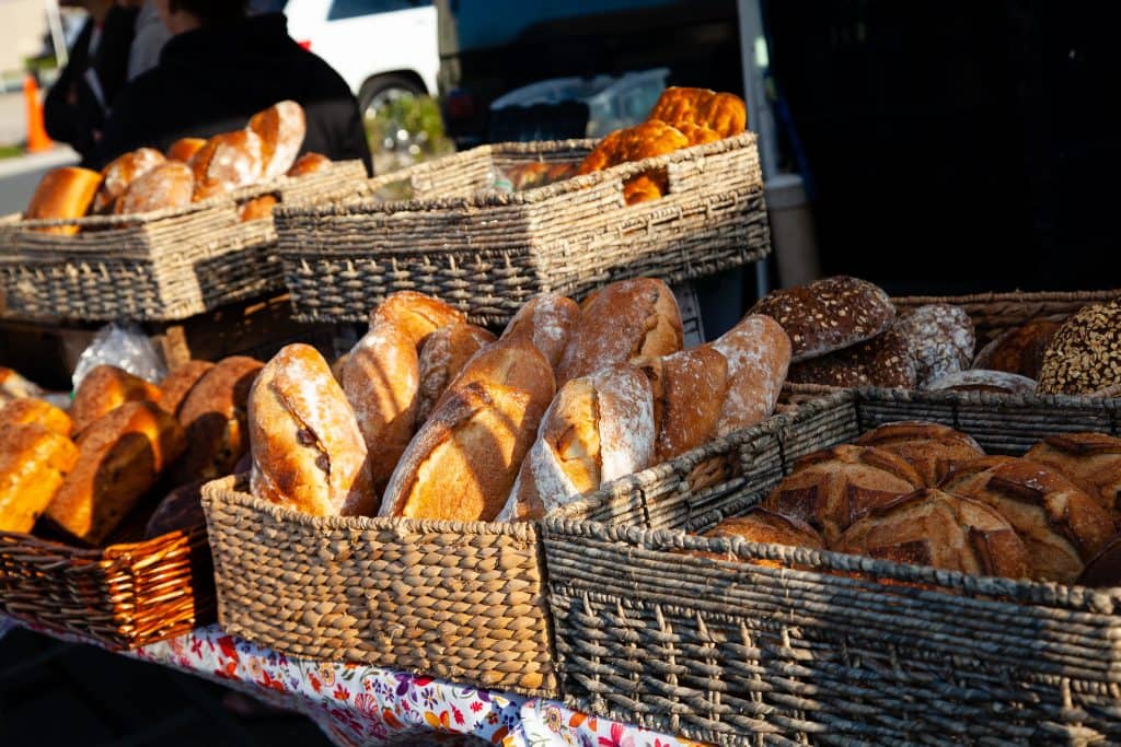 Loaves of fresh baked bread in baskests for sale at market