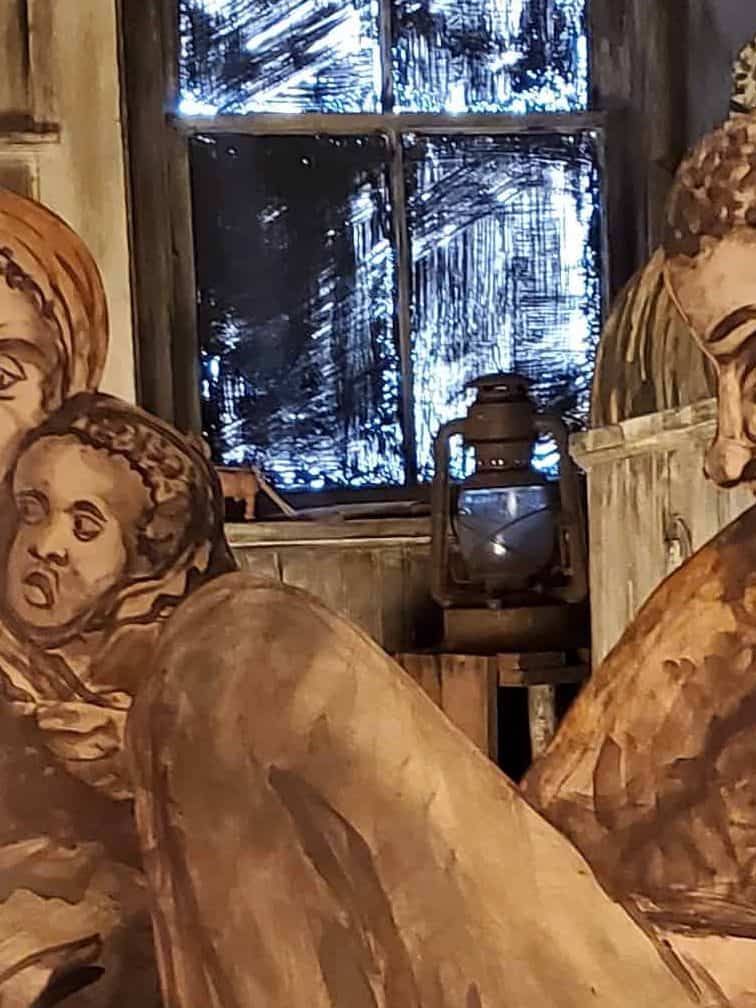 Image at the Bellefonte Art Museum of enslaved people escaping by way of the Underground Railroad